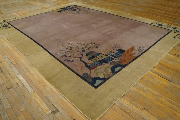 Mauve area rug with wide olive border and detailed scenic pattern rests on distressed wood planks.