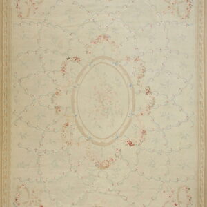 Pale cream rug features a pastel floral trellis pattern, a central oval medallion, and subtle striped borders.