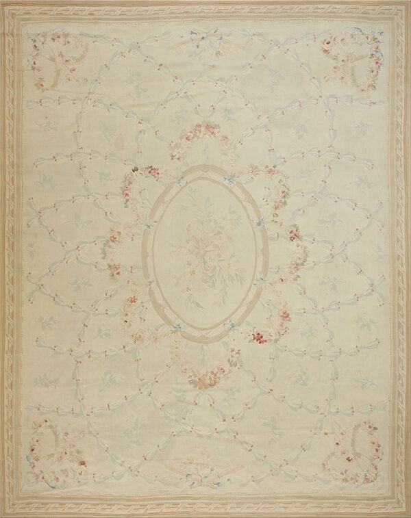 Pale cream rug features a pastel floral trellis pattern, a central oval medallion, and subtle striped borders.