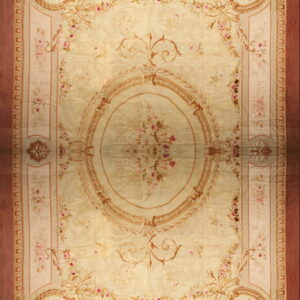 Ornate pale beige rug featuring a large floral medallion, scrolling vines, and a solid reddish outer border.