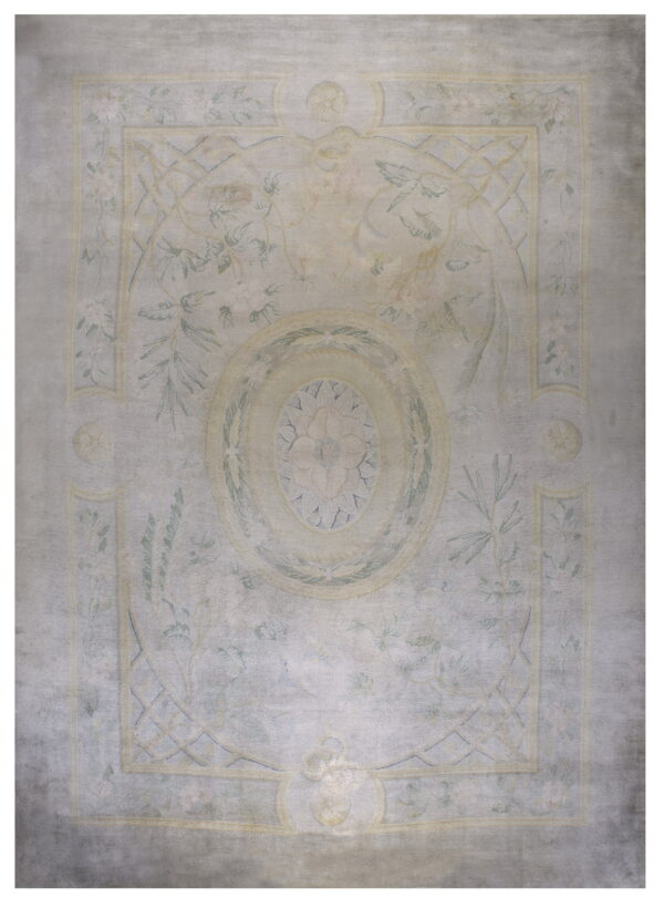 Washed gray area rug with a pale yellow traditional border and muted green botanical designs.