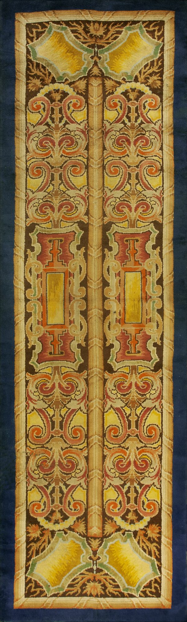 Highly detailed runner featuring symmetrical scrollwork in gold, rust, tan, and dark brown colors.