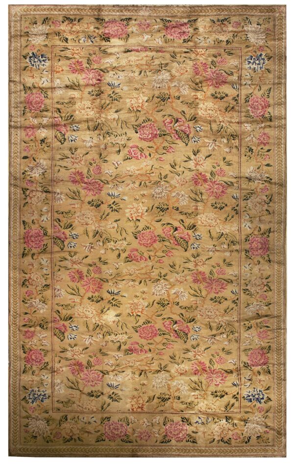 Golden yellow rug with a dense, all-over floral pattern featuring large pink, cream, and blue blossoms.