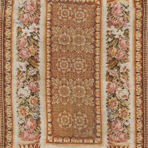 Rectangle rug showing a dense rust floral center framed by wide ivory panels with pink roses.