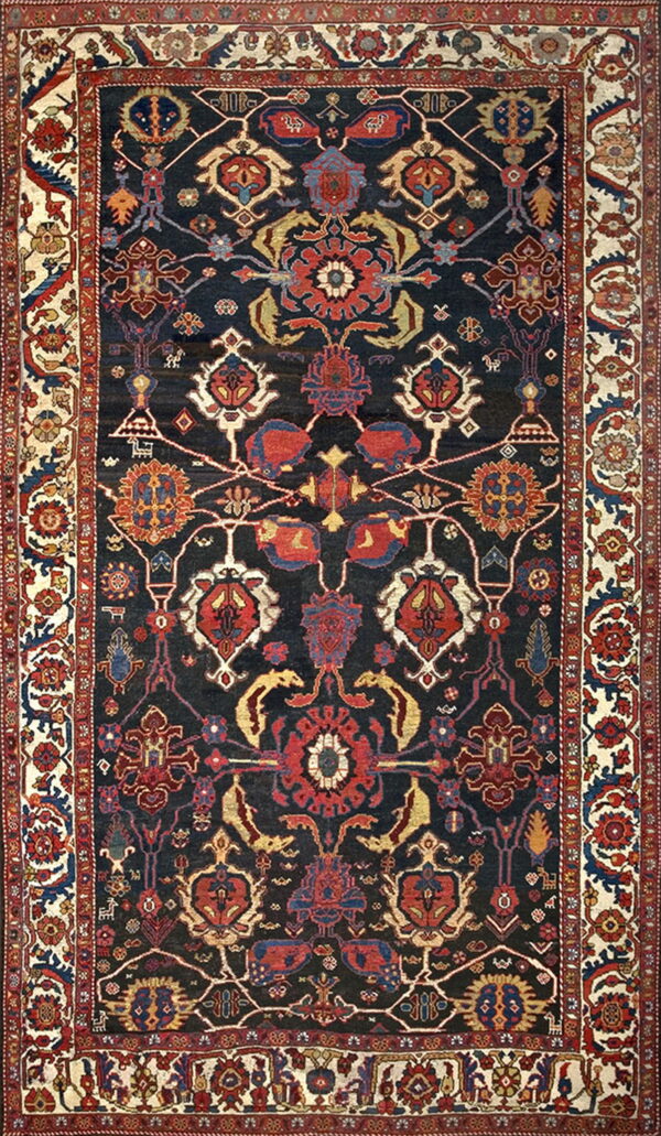 Dark navy rug with a dense traditional pattern of red, blue, and gold florals, framed by a wide ivory border.