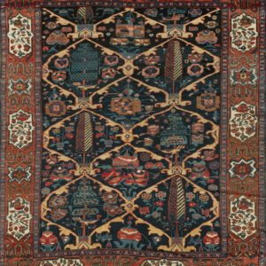 Dark blue patterned rug featuring stylized trees, geometric elements, and a wide terracotta border.