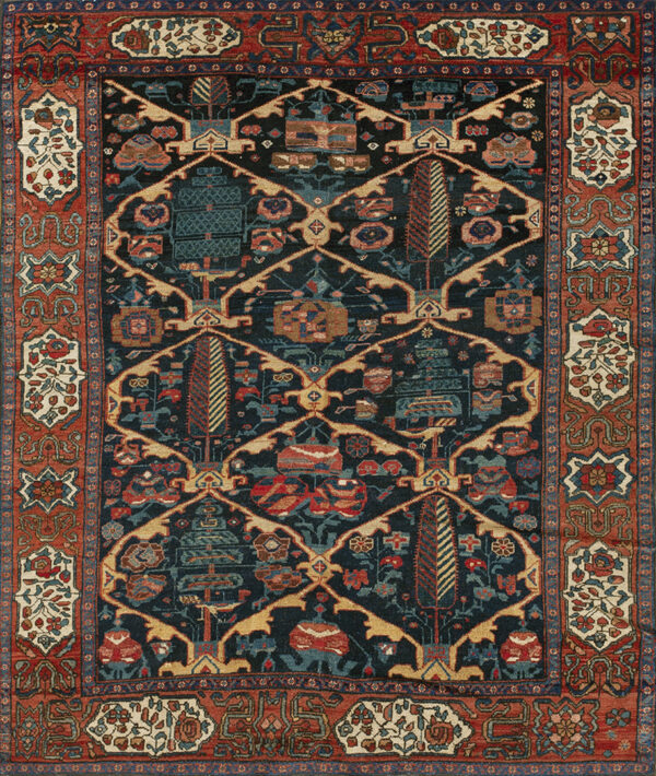 Dark blue patterned rug featuring stylized trees, geometric elements, and a wide terracotta border.