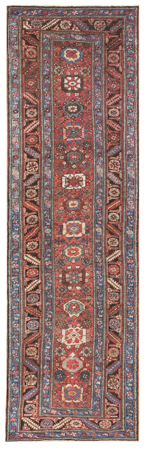 Narrow red runner rug with stacked geometric motifs and complex borders in blue, black, and cream.