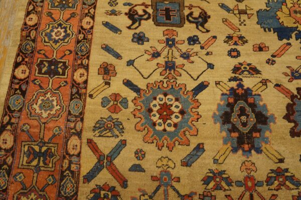 Close-up shows a tan rug with geometric blue and rust motifs and a detailed contrasting orange border.