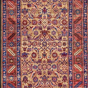 A long traditional runner rug with a tan field and intricate red and blue floral patterns.