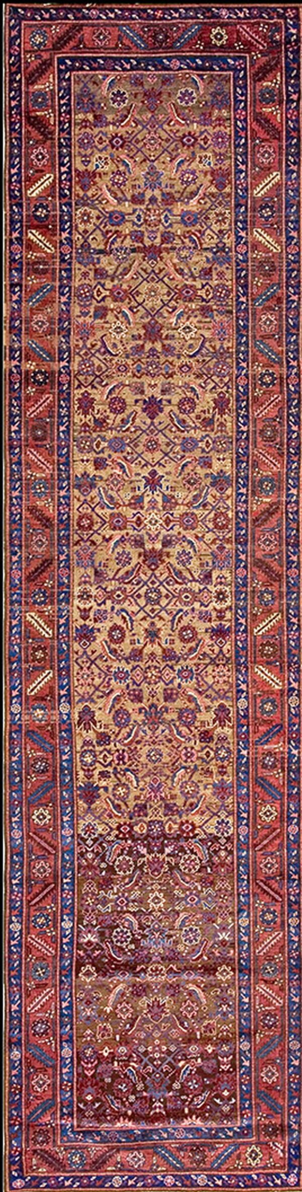 A long traditional runner rug with a tan field and intricate red and blue floral patterns.