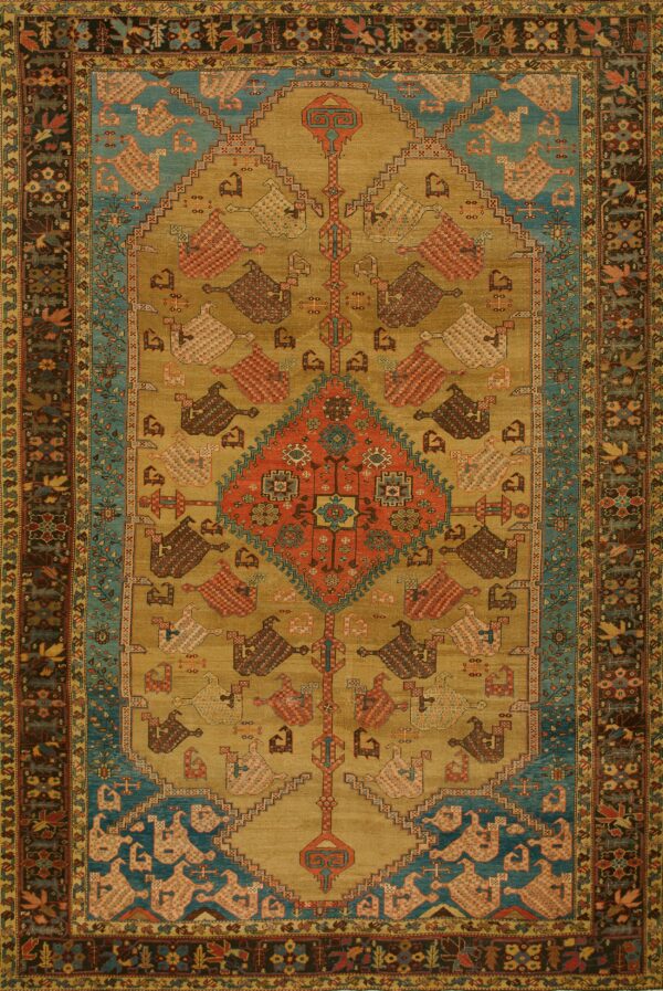 Low-pile rug with a gold field, red center medallion, stylized geometric bird figures, and a turquoise border.