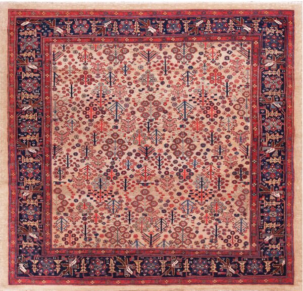 Beige patterned rug featuring stylized tree designs and a deep navy border with geometric bird motifs.