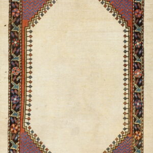 Low-pile rug with a cream center arch, detailed red and blue zig-zag panels, and a dark geometric floral border.