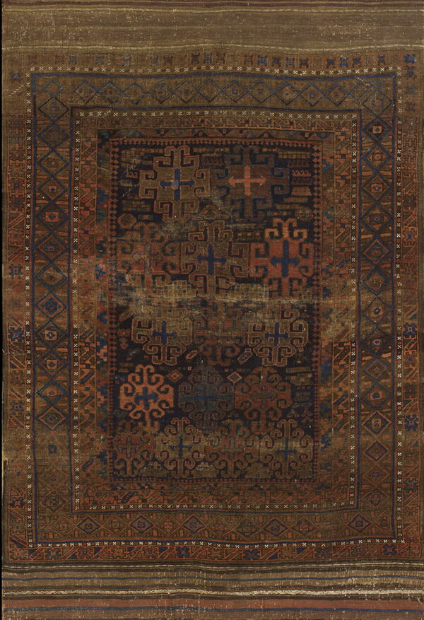 Distressed rug with dark navy, rust, and brown geometric patterns and complex, detailed borders.