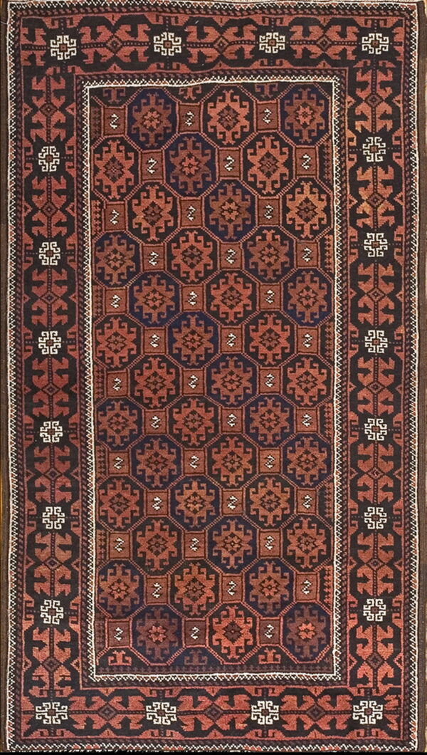 Rust red and navy blue geometric motifs fill the field of this dark brown bordered rug.