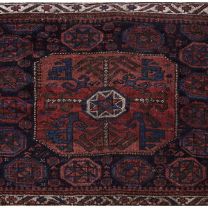 Square dark navy rug with a large central red medallion and geometric blue and maroon octagons.