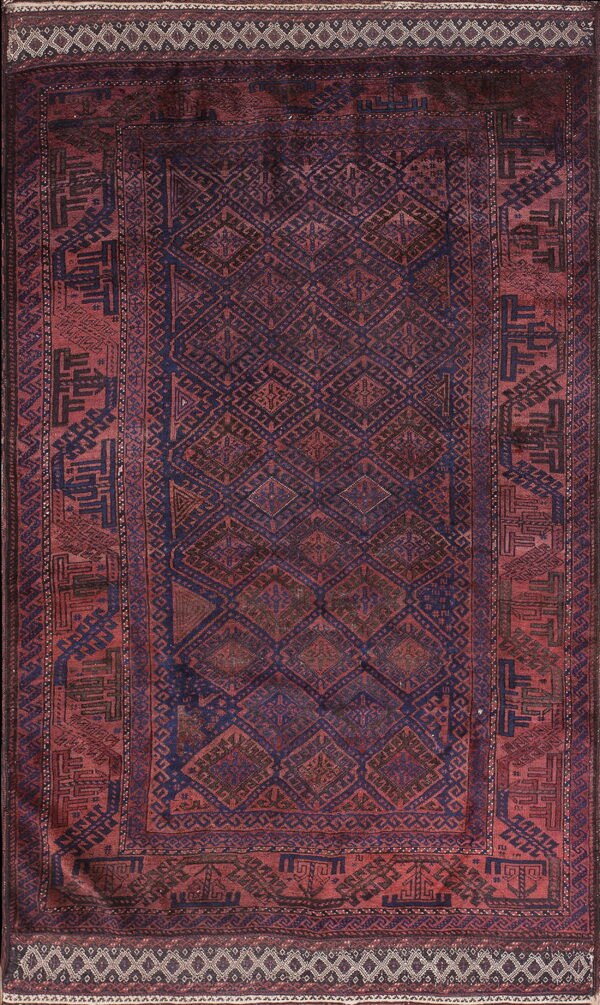 Geometric rug in rich reds and indigo blue features a center diamond lattice and stylized borders.