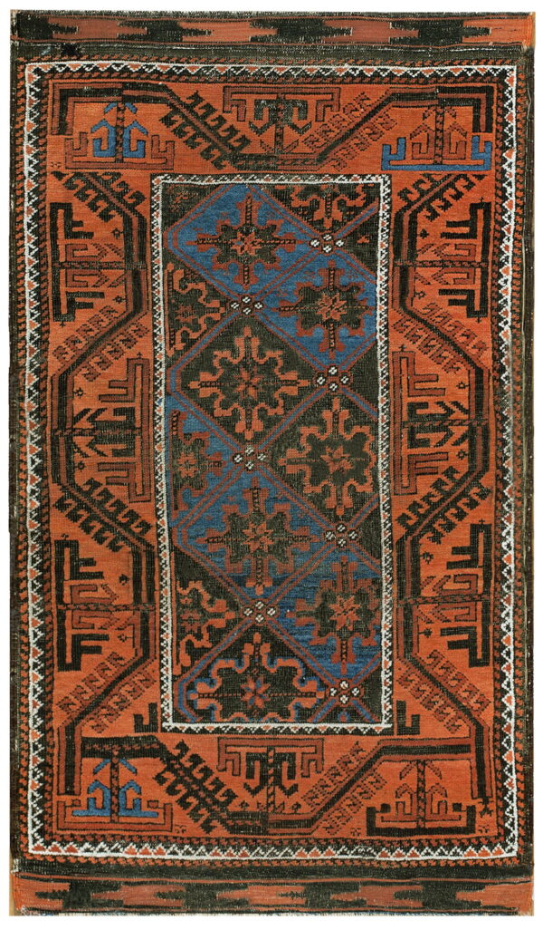 Geometric rug in rust orange, dark brown, and blue with a detailed central diamond pattern.