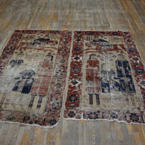 A low-pile, distressed rug with faded red, blue, and tan figurative patterns rests on wood planks.