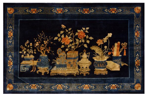 A deep blue rug features vases, flowers, and objects in gold and orange, bordered by blue fretwork.