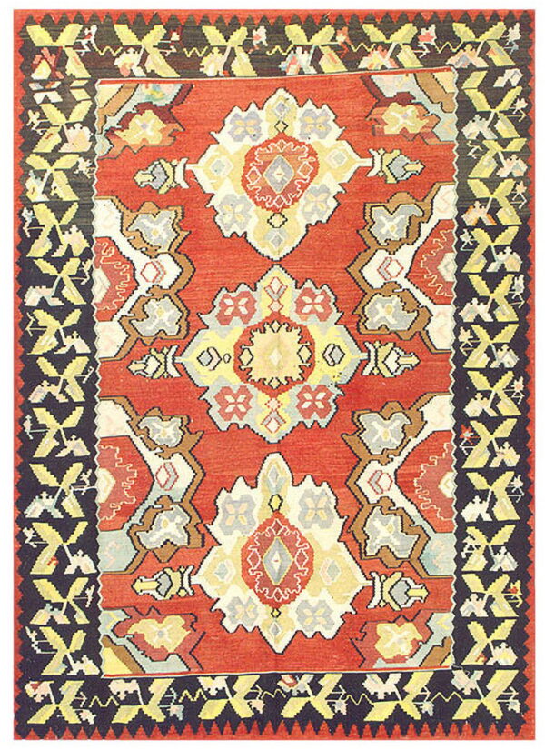 Flatweave rug with a red center, geometric yellow and gray medallions, and a wide dark border.
