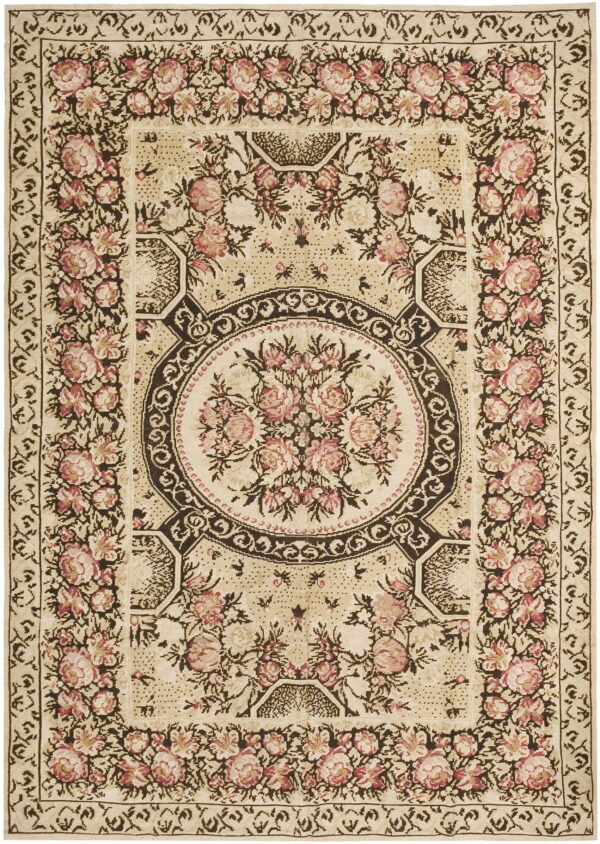 Cream rug with pink floral motifs and dark brown scrolling borders surrounding a central bouquet.