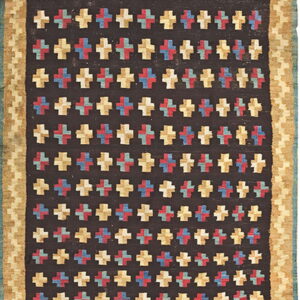 Dark runner with repeating multicolored cross pattern and wide tan borders featuring a geometric design.