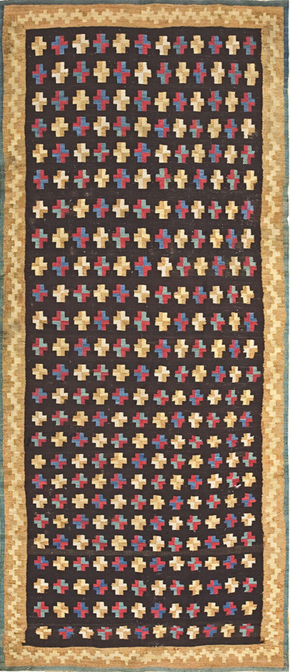 Dark runner with repeating multicolored cross pattern and wide tan borders featuring a geometric design.