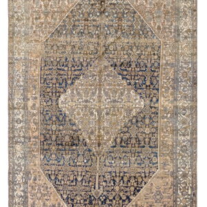 Rectangular rug with an intricate central navy diamond medallion and a cream and pink field.