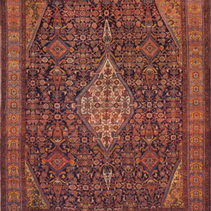 Intricate, dark navy rug with an ornate cream central medallion and wide rust-red patterned borders.