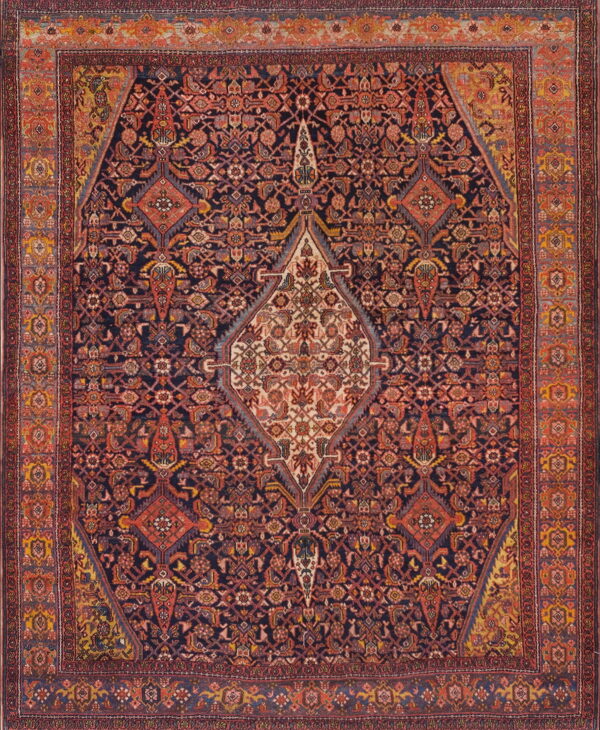 Intricate, dark navy rug with an ornate cream central medallion and wide rust-red patterned borders.