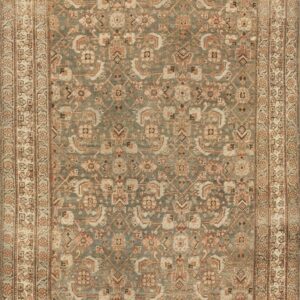 Runner rug featuring a muted green field, detailed patterns, and multi-layered borders in cream and rust.