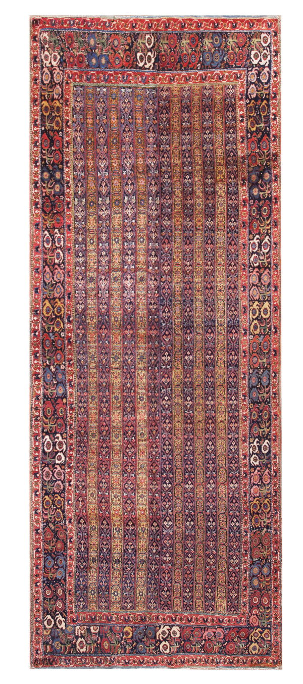 Rectangular rug with dense multicolored vertical stripes and a broad dark border featuring stylized flowers.