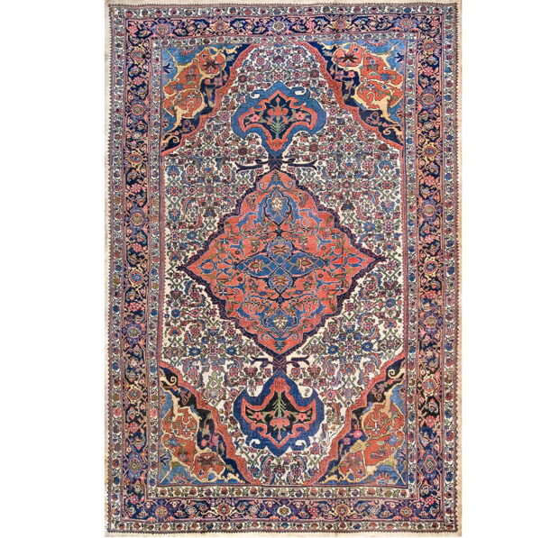 Traditional rug featuring a central coral and navy medallion on an intricately patterned ivory field.