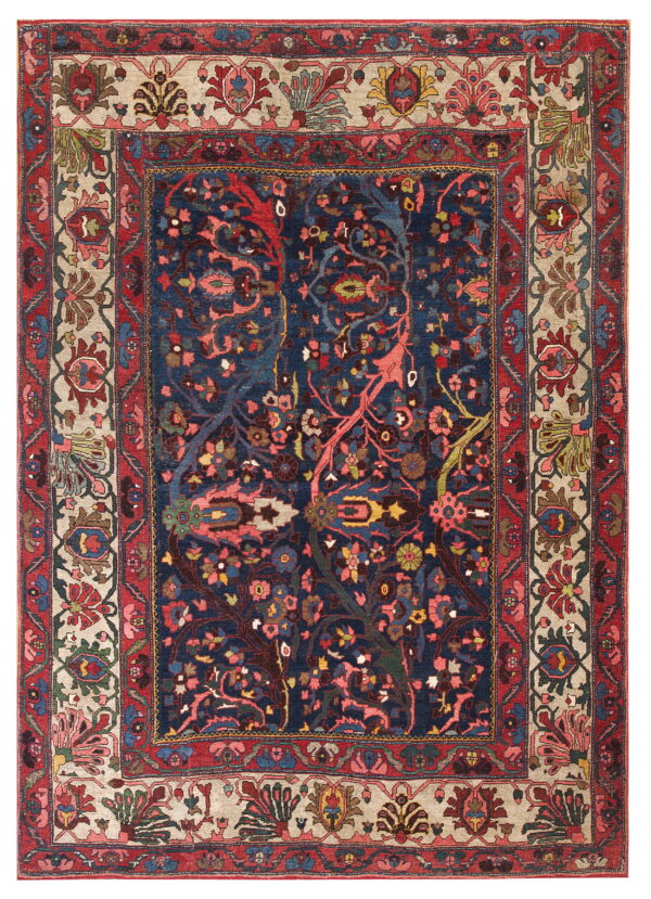 Navy blue rug with intricate multi-color botanical patterns and elaborate red and light beige borders.