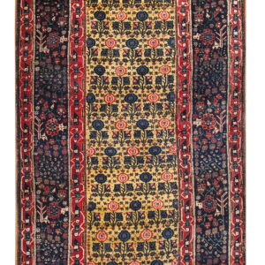 Long runner rug featuring a yellow central field with repeating floral motifs bordered by dense navy and red patterns.