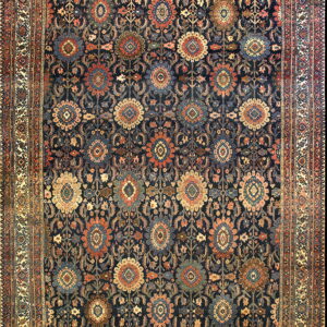 Navy rug featuring intricate repeating medallions and boteh in contrasting cream, rust, and teal colors.