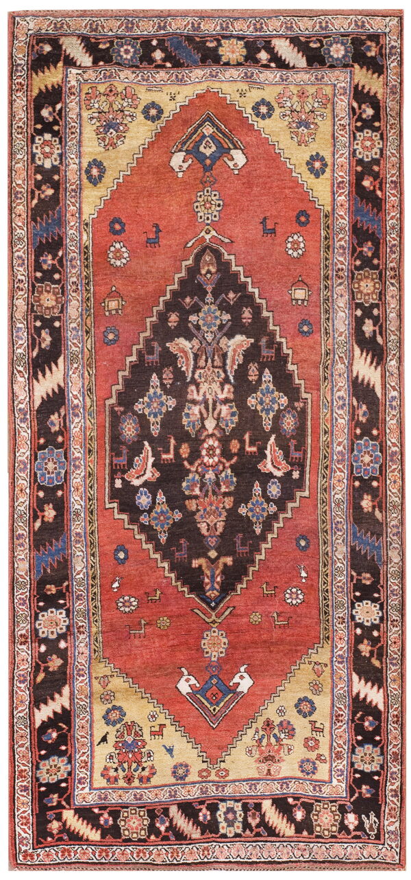 Terracotta and dark brown rug featuring a geometric medallion, stylized animal figures, and patterned borders.
