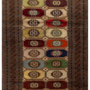 Rectangular runner rug featuring a grid of multicolored squares with centralized medallions within a complex patterned brown border.