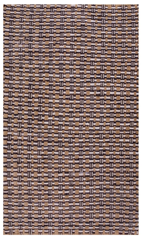 Chunky flatweave rug in tan, dark brown, and white with an abstract woven grid pattern.