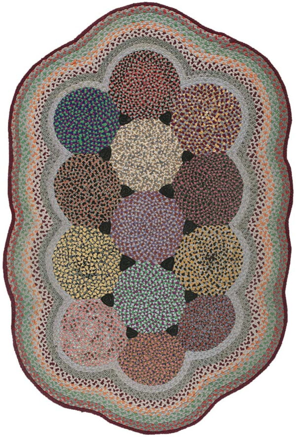 Oval braided rug made of multicolored joined circular patches surrounded by variegated gray and green rings.