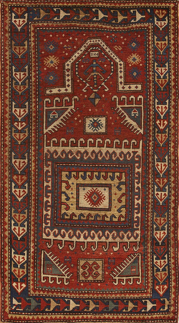 Red and blue tribal rug with geometric patterns, central stepped medallion, and intricate stacked borders.