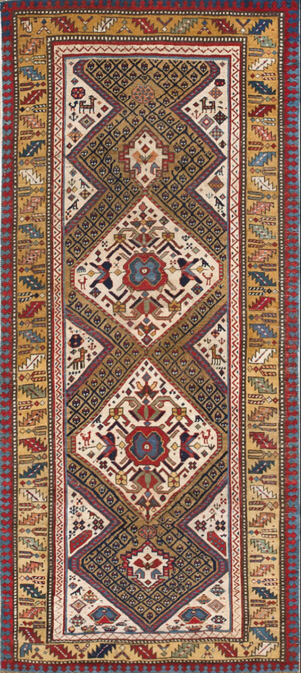 Geometric runner rug in navy, cream, red, and gold, featuring stylized tribal animal and stepped patterns.