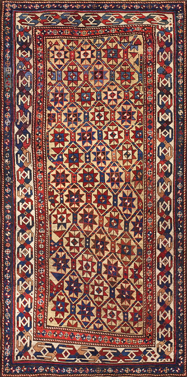 Low pile rug with a complex red, navy blue, and cream geometric pattern and detailed multi-band borders.