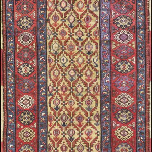 Geometric runner rug featuring a central tan field of repeating diamonds flanked by wide red and blue borders.