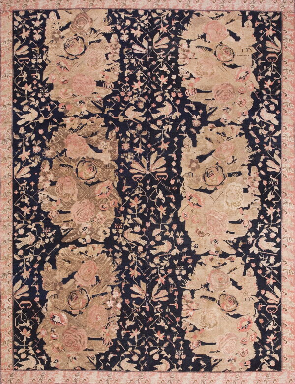 Navy blue rug with large beige and pink floral patterns, featuring distressed sections and small detailed birds.