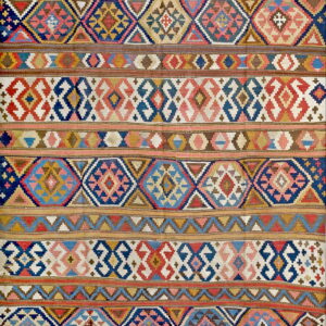 Flatweave rug with multicolor geometric patterns, including diamonds and zigzags, across horizontal stripes.