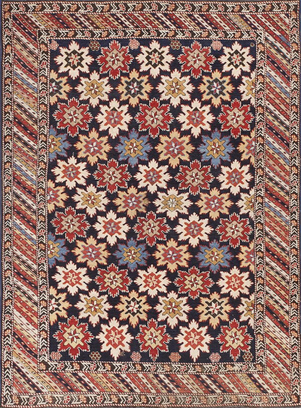 Navy rug featuring red, cream, and blue geometric motifs and a detailed striped, patterned border.