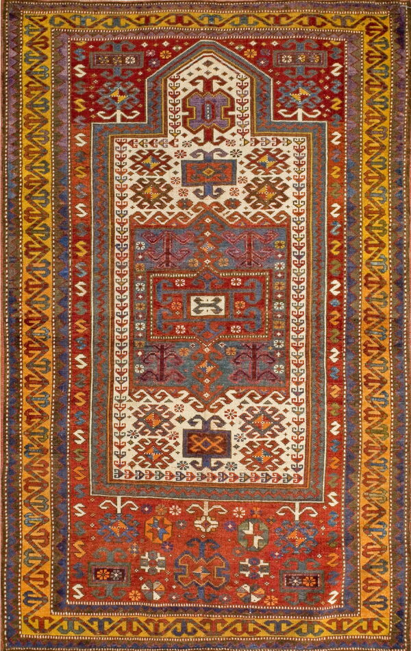 Geometric prayer rug design featuring dense tribal motifs on red, indigo, and cream fields.